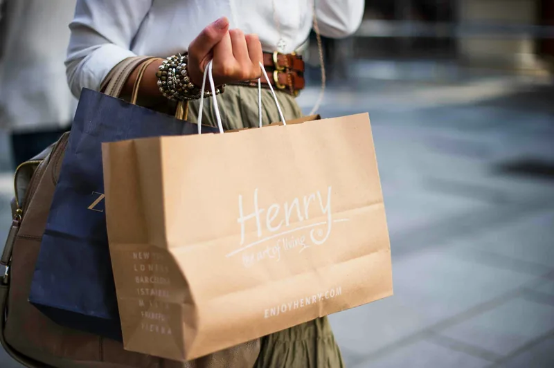 Shopper carrying bags after using a personal loan